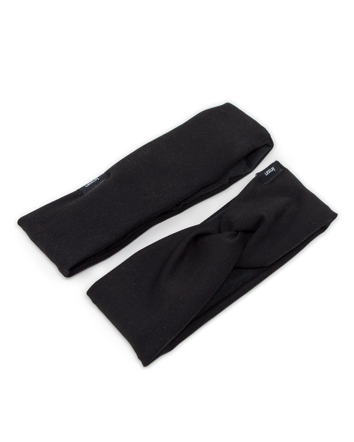 Deux bandeaux isolés en asclépiade, extérieur noir : modèle torsadé et bandeau sport à couture droite, faits au Québec.