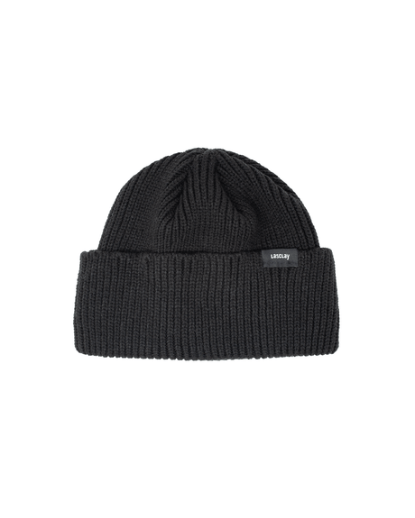 Tuque de ville tricotée noire en acrylique à revers Lasclay, maille côtelée, bandeau isolant à la soie d'asclépiade, chaude pour l'hiver québécois, sur fond blanc.